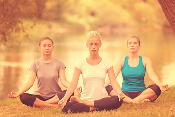 Image showing women meditating and doing yoga exercise