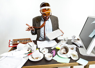 Image showing Young man spilled coffee on the keyboard