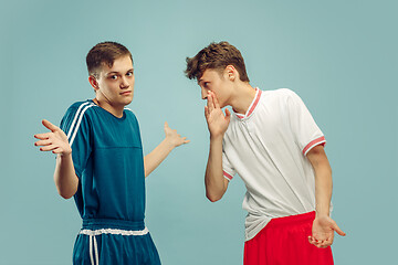 Image showing Two young men isolated on blue background