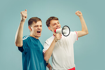 Image showing Two young men isolated on blue background