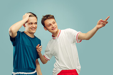 Image showing Two young men isolated on blue background