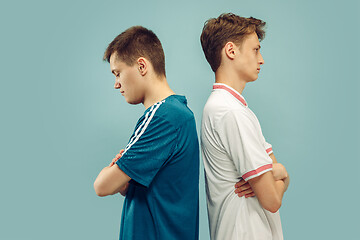 Image showing Two young men isolated on blue background