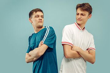 Image showing Two young men isolated on blue background