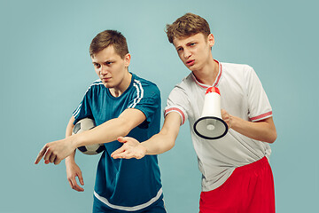 Image showing Two young men isolated on blue background