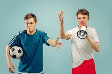 Image showing Two young men isolated on blue background