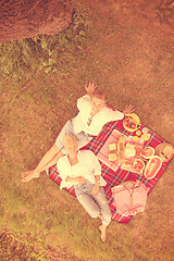 Image showing top view of couple enjoying picnic time