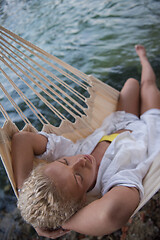 Image showing blonde woman resting on hammock