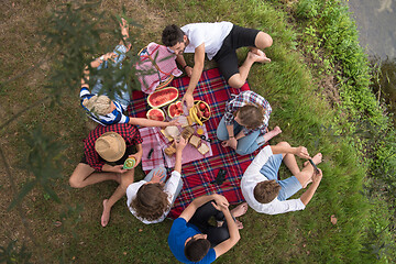 Image showing top view of group friends enjoying picnic time