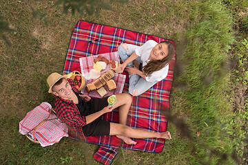 Image showing top view of couple enjoying picnic time