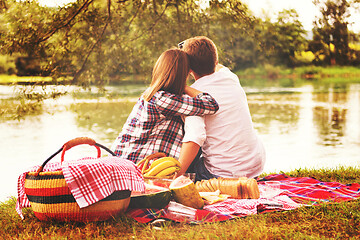 Image showing Couple taking a selfie by mobile phone while enjoying picnic tim