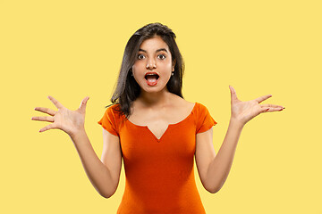 Image showing Portrait of beautiful woman isolated on yellow studio background