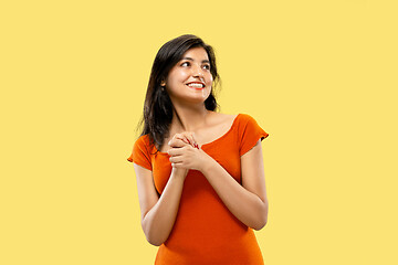 Image showing Portrait of beautiful woman isolated on yellow studio background