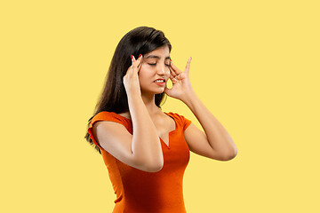 Image showing Portrait of beautiful woman isolated on yellow studio background