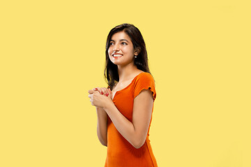 Image showing Portrait of beautiful woman isolated on yellow studio background