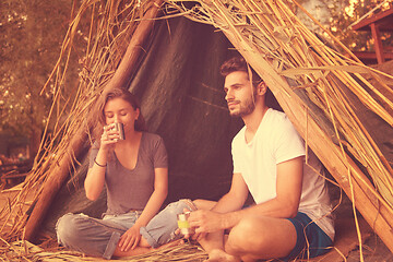 Image showing couple spending time together in straw tent