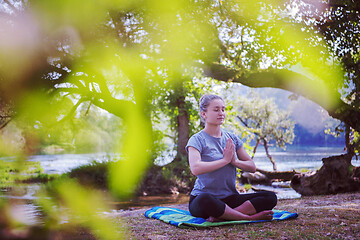 Image showing woman meditating and doing yoga exercise