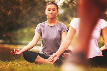 Image showing women meditating and doing yoga exercise