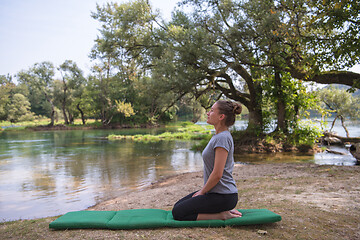 Image showing woman meditating and doing yoga exercise