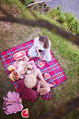 Image showing top view of couple enjoying picnic time