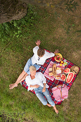 Image showing top view of couple enjoying picnic time