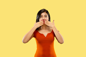 Image showing Portrait of beautiful woman isolated on yellow studio background