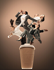Image showing Office workers jumping isolated on studio background