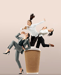 Image showing Office workers jumping isolated on studio background