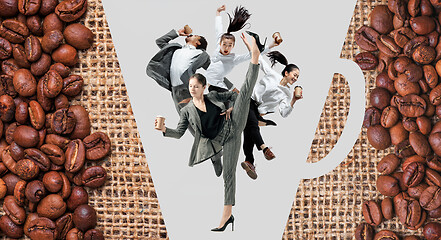 Image showing Office workers jumping isolated on studio background