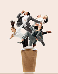 Image showing Office workers jumping isolated on studio background