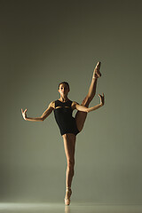 Image showing Young graceful female ballet dancer dancing in mixed light