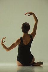 Image showing Young graceful female ballet dancer dancing in mixed light