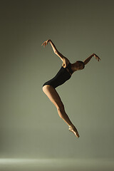 Image showing Young graceful female ballet dancer dancing in mixed light