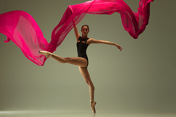 Image showing Young graceful female ballet dancer dancing in mixed light