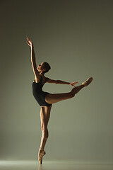 Image showing Young graceful female ballet dancer dancing in mixed light