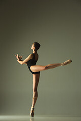 Image showing Young graceful female ballet dancer dancing in mixed light