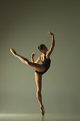 Image showing Young graceful female ballet dancer dancing in mixed light