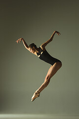 Image showing Young graceful female ballet dancer dancing in mixed light