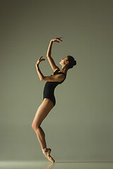 Image showing Young graceful female ballet dancer dancing in mixed light