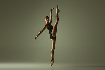 Image showing Young graceful female ballet dancer dancing in mixed light