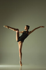 Image showing Young graceful female ballet dancer dancing in mixed light