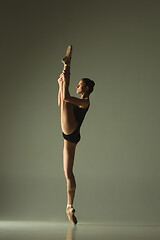 Image showing Young graceful female ballet dancer dancing in mixed light