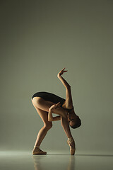 Image showing Young graceful female ballet dancer dancing in mixed light