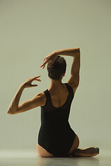 Image showing Young graceful female ballet dancer dancing in mixed light