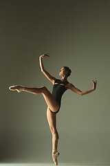 Image showing Young graceful female ballet dancer dancing in mixed light