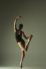 Image showing Young graceful female ballet dancer dancing in mixed light