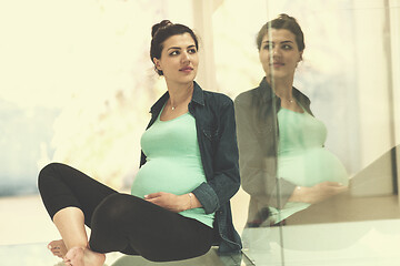 Image showing pregnant women sitting on the floor