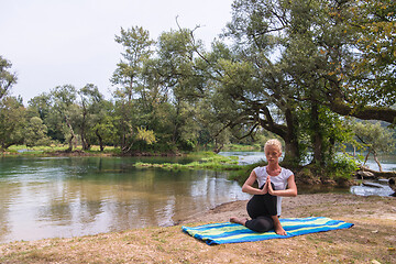 Image showing woman meditating and doing yoga exercise