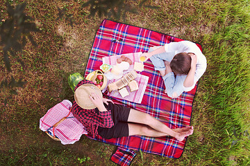 Image showing top view of couple enjoying picnic time