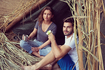 Image showing couple spending time together in straw tent