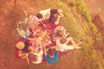 Image showing top view of group friends enjoying picnic time